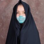 woman in black hijab and abaya