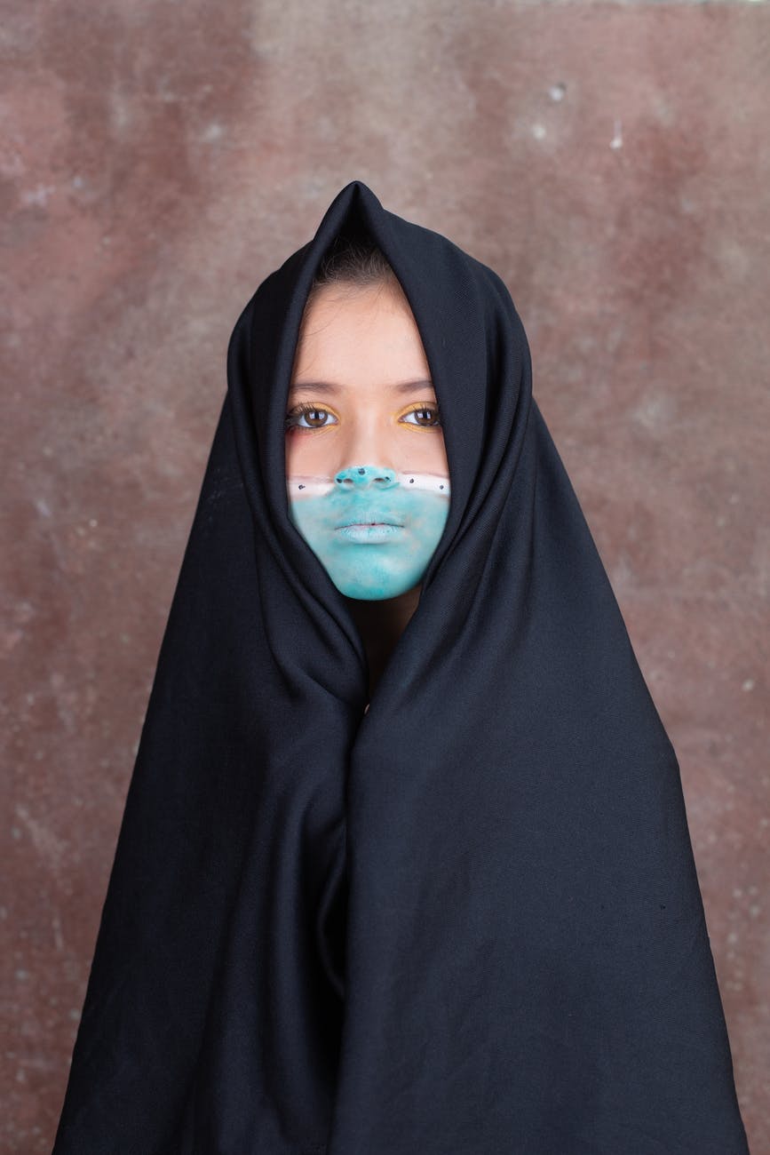 woman in black hijab and abaya